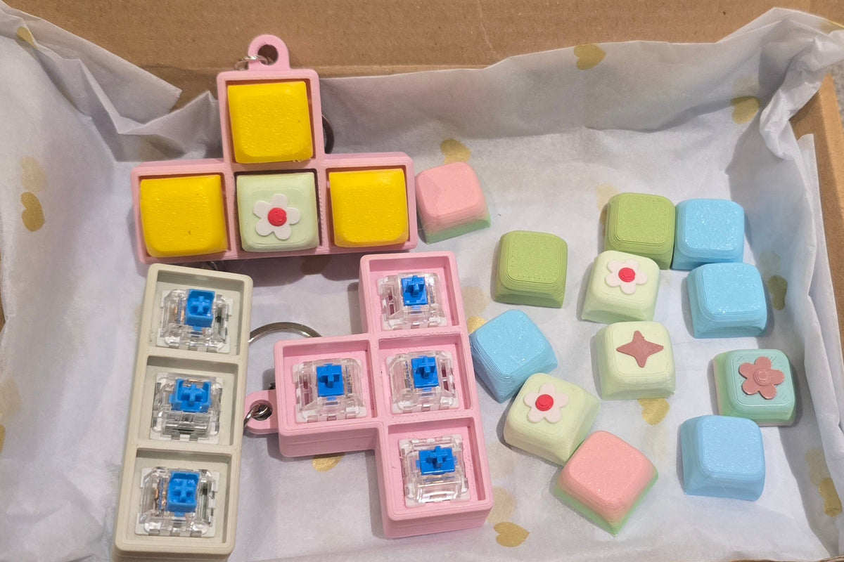 Mystery Clicker Box — clicker-sleutelhangers met mechanical switches en gekleurde keycaps